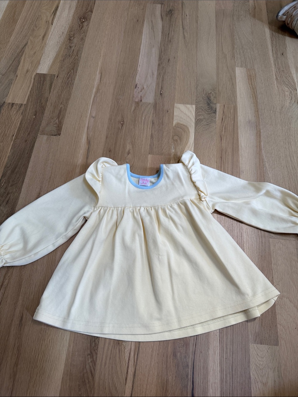 Baby Cream Long-Sleeve Ruffle Shoulder Top with Blue Trim